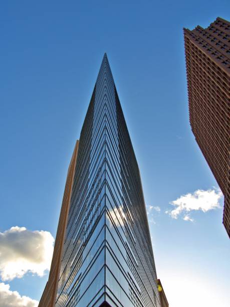 istock Low Angle View Of Modern Building Against Blue Sky 1169128967