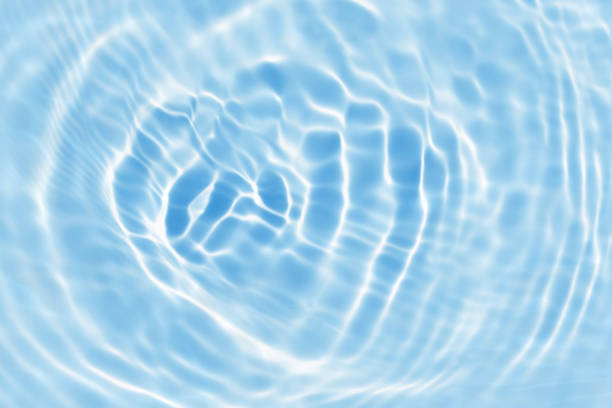 istock blue wave abstract or natural rippled water texture background 1169132044