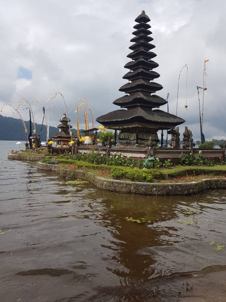 Floating temple in Bali Floating temple in Bali waters floating temple in lake bedugul bali stock pictures, royalty-free photos & images