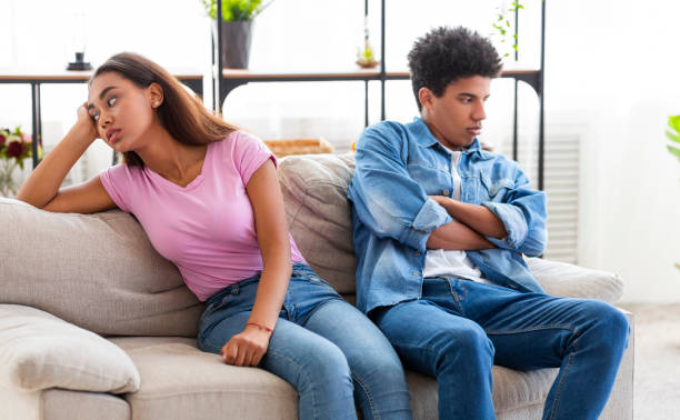 istock Relationship problem. Black teenage couple ignoring each other after argument 1169134455