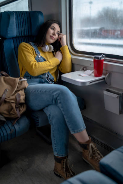 istock Young woman traveling by train 1169134528