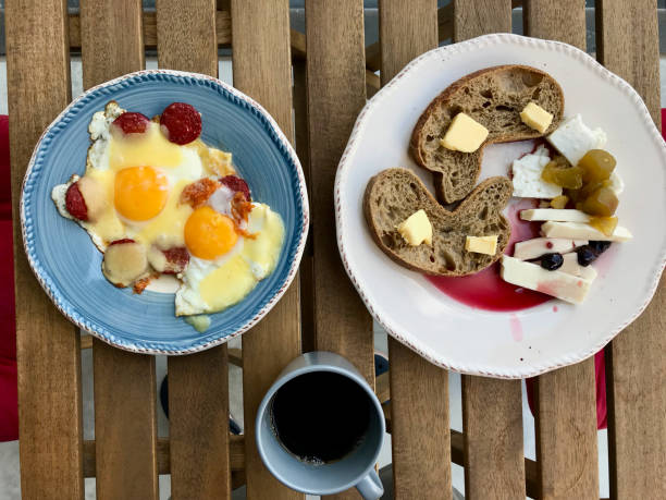 istock Turkish Breakfast Sucuk with Fried Eggs, Melted Cheese, Butter Bread and Jam / Marmalade served with Fresh Filter Coffee. 1169135953