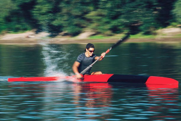 istock Young athlete in a canoe. Motion blur 1169136419