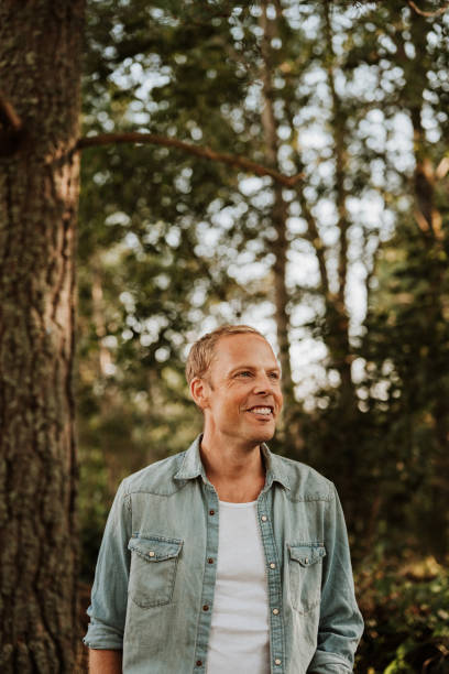 istock Man walking in green nature 1169136996