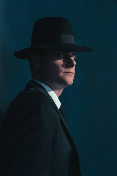 istock Retro man in hat wears suit and tie. 1169137358