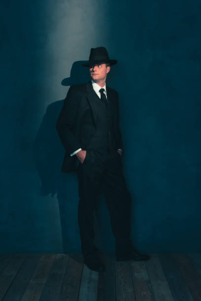 istock Retro man in hat wears suit and tie. 1169137375