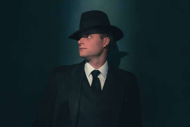 istock Retro man in hat wears suit and tie. 1169137377