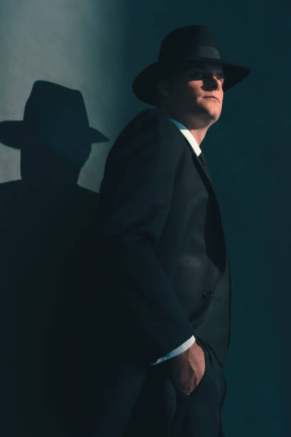 istock Retro man in hat wears suit and tie. 1169137384