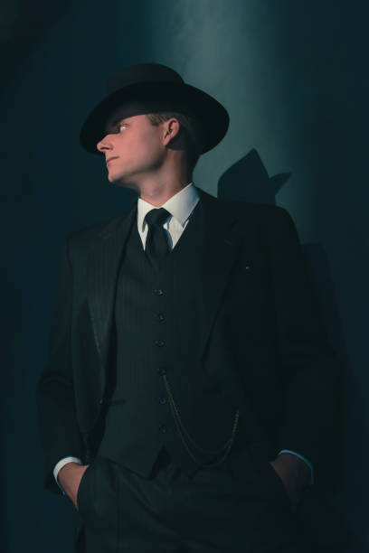 istock Retro man in hat wears suit and tie. 1169137385