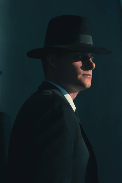 istock Retro man in hat wears suit and tie. 1169137394