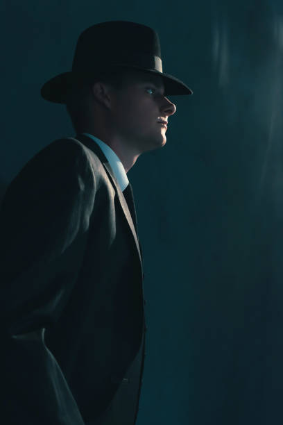 istock Retro man in hat wears suit and tie. 1169137415