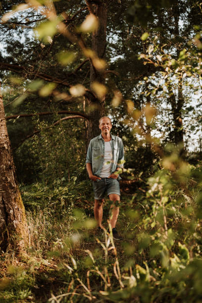 istock Man walking in green nature 1169137635