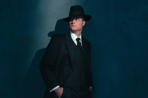 istock Retro man in hat wears suit and tie. 1169137741