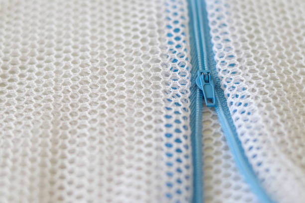 White mesh bag with blue zipper for washing machine.