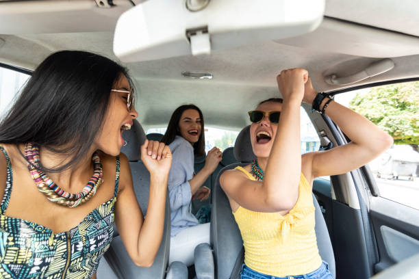 istock Woman dancing in a car 1169139118