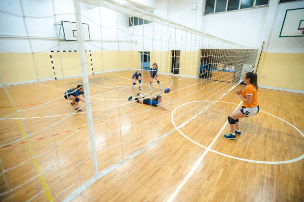 istock Female volleyball player digs 1169141199