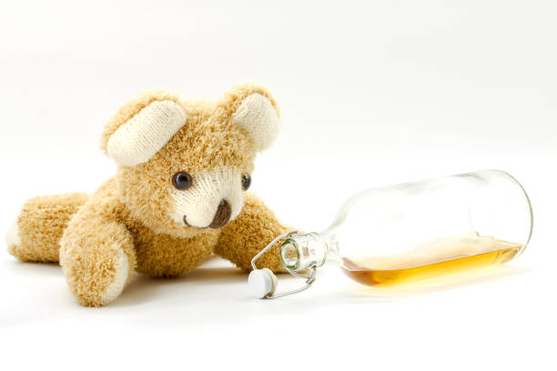 istock Teddy bear with a bottle of alcohol 1169141661