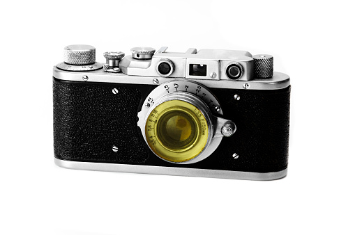 Old model film camera on white background