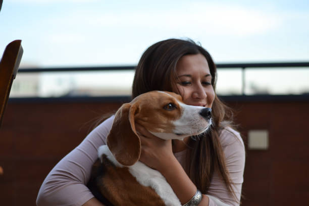 istock Young woman with beagle 1169144507