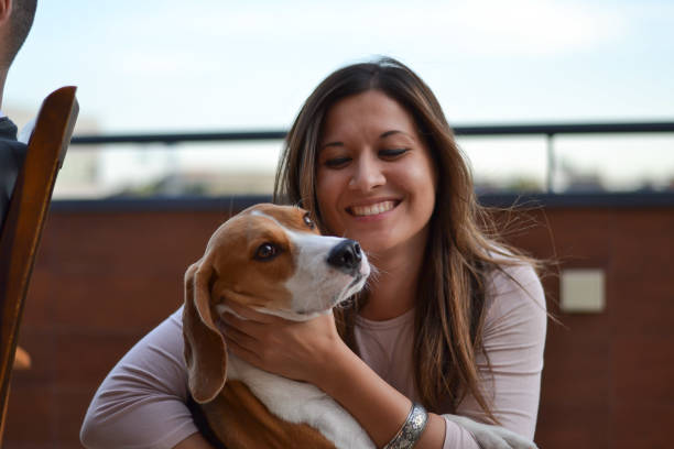 istock Young woman with beagle 1169144515