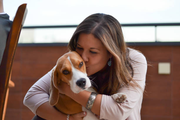 istock Young woman with beagle 1169144566