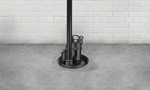 Submersible water Pump for flood prevention in a basement floor Submersible water Pump for flood prevention in a basement floor water pump photos stock pictures, royalty-free photos & images