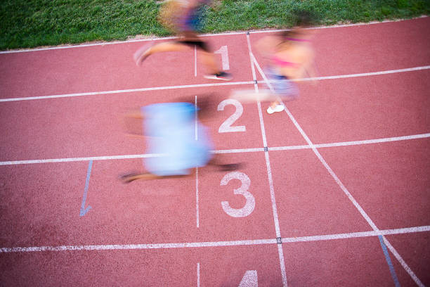 istock Athletes Crossing the Finish Line 1169145729