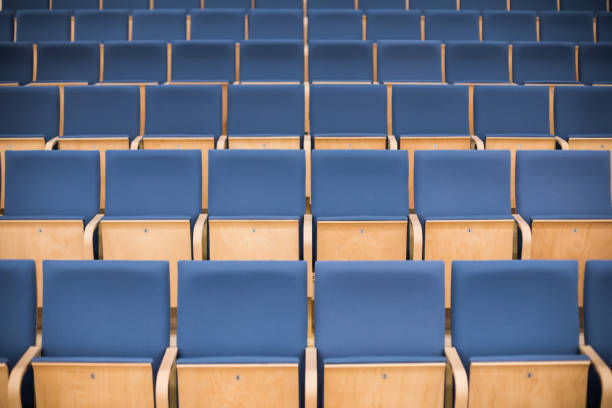 istock Empty blue seats in a conference room 1169146004
