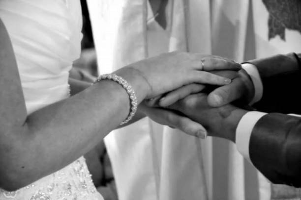istock Hands at church 1169146948