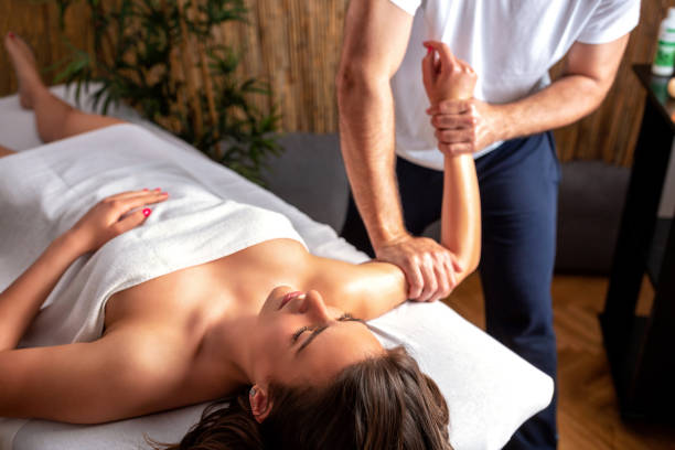 istock Sexy woman having an arm massage 1169147380