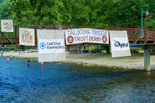 Cherokee, North Carolina,USA - August 3,2019:  A fishing trout derby being held in the Oconaluftee River in Cherokee, North Carolina