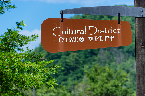 Cherokee, North Carolina,USA - August 3,2019: Cultural District sign hanging on a post in downtown Cherokee, NC.