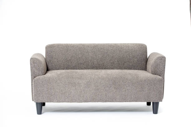 grey cozy flannel loveseat sofa A grey cozy flannel loveseat sofa isolated on white background. loveseat stock pictures, royalty-free photos & images