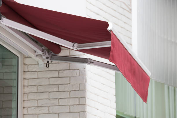red awning over window of shop.