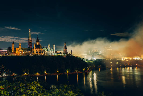 istock Canadian Parliament on Ottawa River with fireworks 1169150461