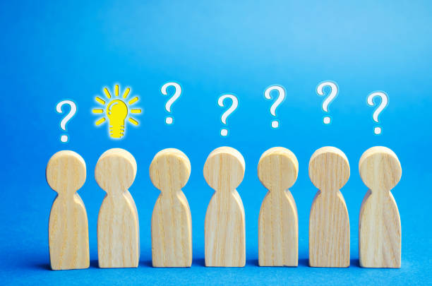 istock Team of workers with question marks and light bulb of an idea. Ideas and innovation. Creative business process. Strategy and Management. Talented employee concept 1169151224