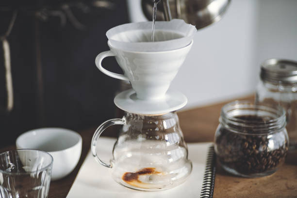istock Drip coffee on a wooden bar White background 1169151375