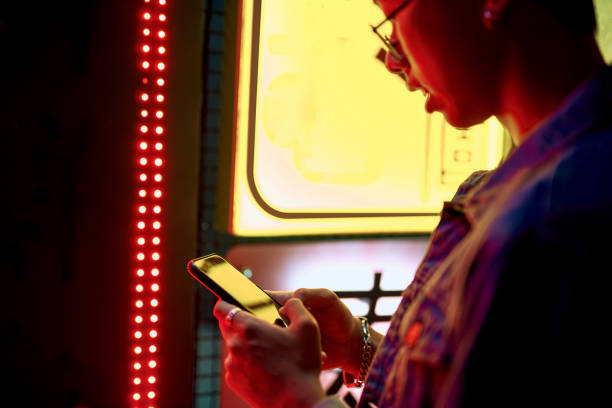 istock Young asian man with mobile phone near cafe 1169152140