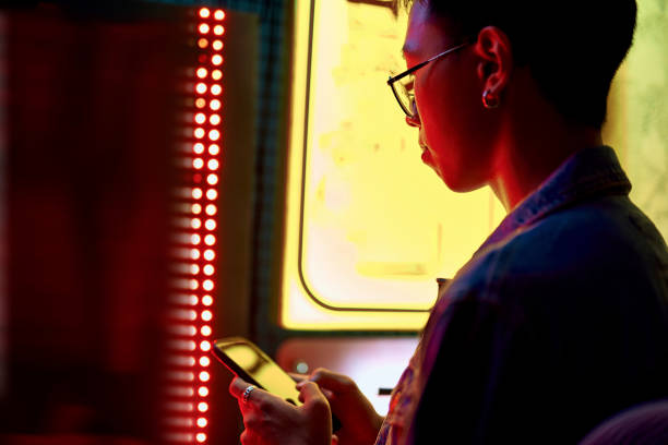 istock Asian guy with mobile phone near japanese cafe 1169152146