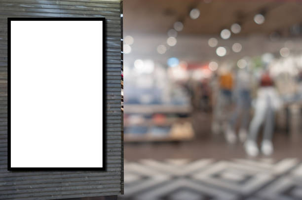 istock blank showcase billboard or advertising light box for your text message or media content with blurred image popular women fashion clothes shop showcase in shopping mall, commercial, marketing concept 1169153855