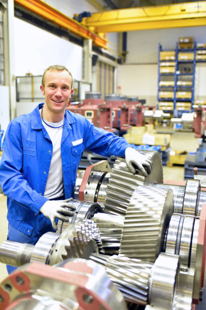 portrait of young cheerful workers in mechanical engineering