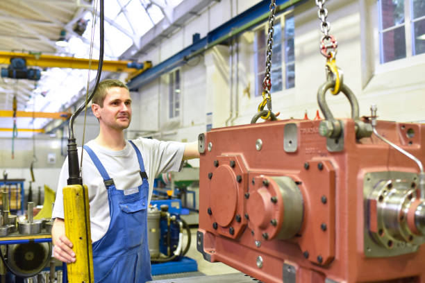 istock modern mechanical engineering - gear manufacturing factory - assembly by young workers 1169155354