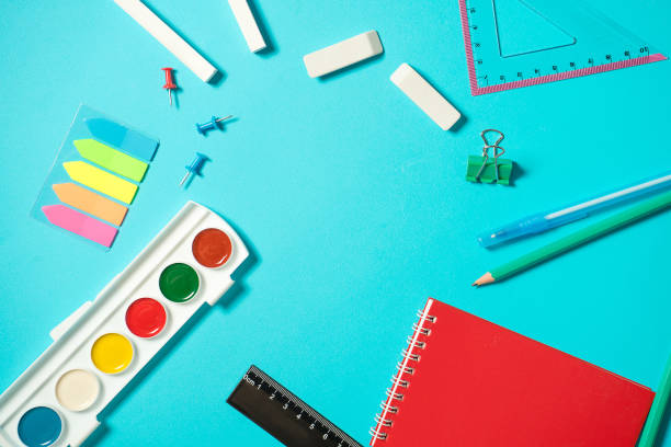 istock Back to school mock up. Flat lay composition with a watercolor, pencil, notebooke, ruler, eraser. Isometric concept on blue background. Pop art. School supplies. overhead. Branding mock up stationery 1169155615