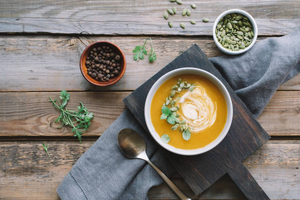 istock Pumpkin cream soup in bowl 1169157218
