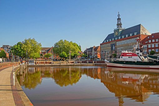 The town hall at the Ratsdelft of Emden with ships.