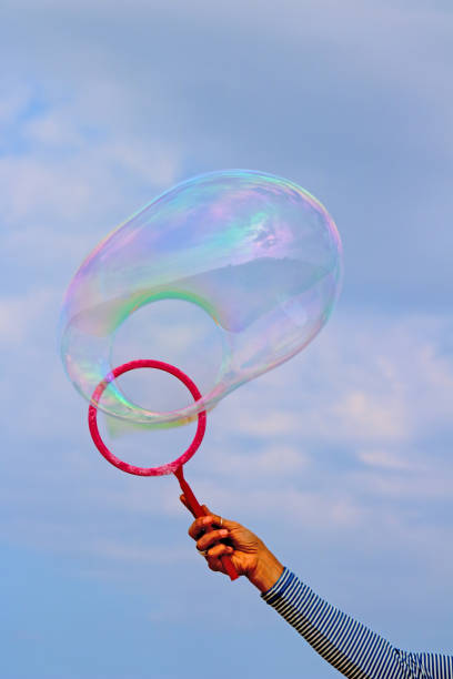 istock person forming large soap bubble 1169158705