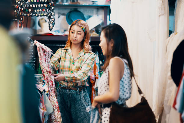 istock Sales clerk assisting a customer in a thrift store 1169159063