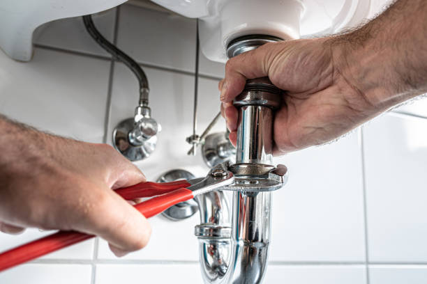 istock man repairing sink trap with adjustable pipe wrench 1169161891