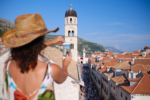 young tourist takes photo in Dubrovnik