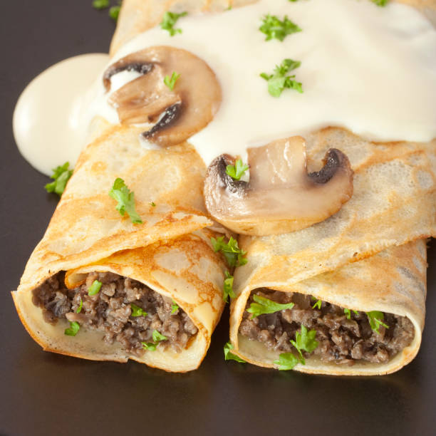 istock Crepes Stuffed with Mushrooms Pancakes 1169167566